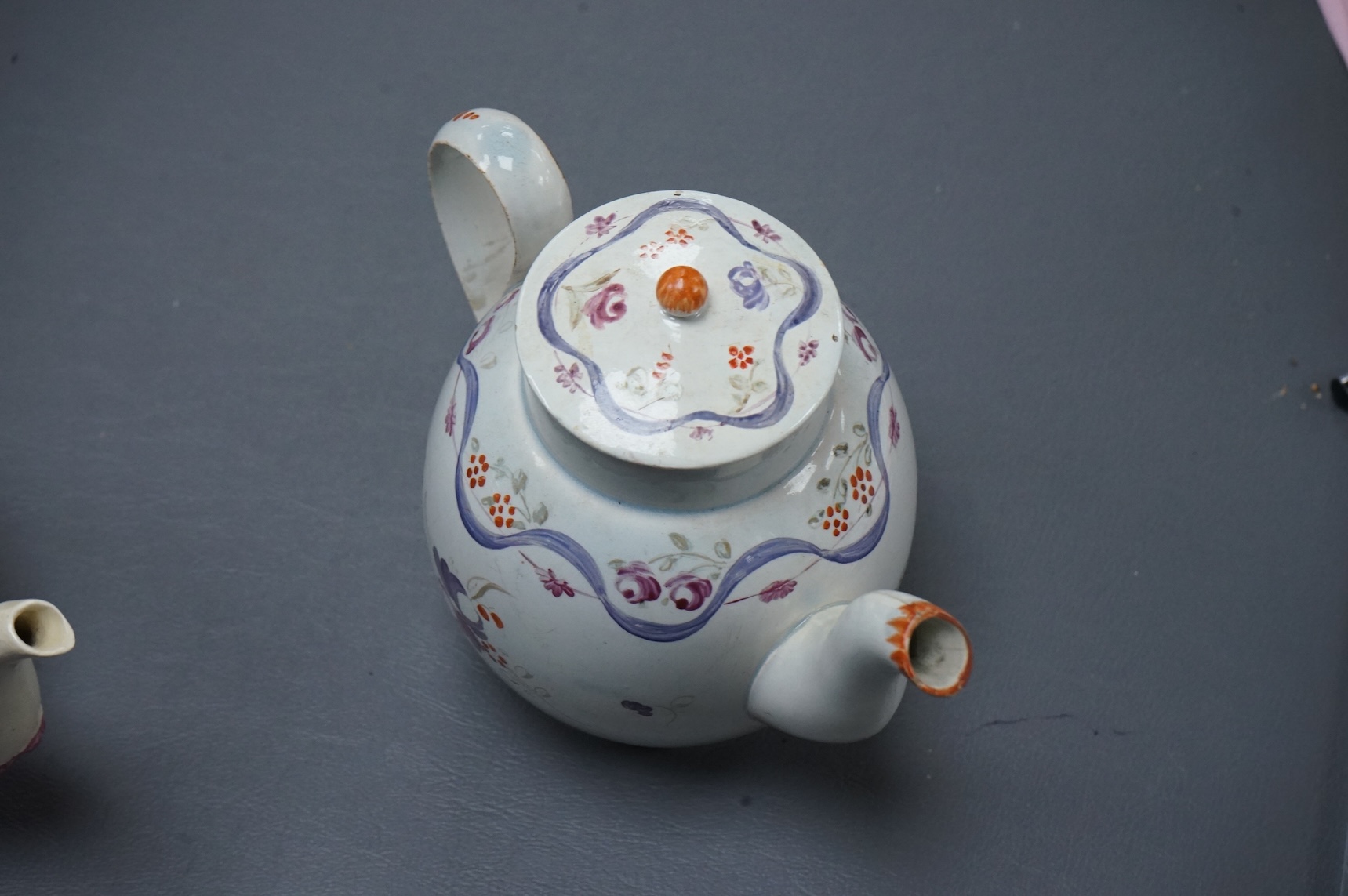 Leeds pottery, a creamware teapot, c.1785 and a pearlware teapot, c.1795, both stamped, tallest 13cm high